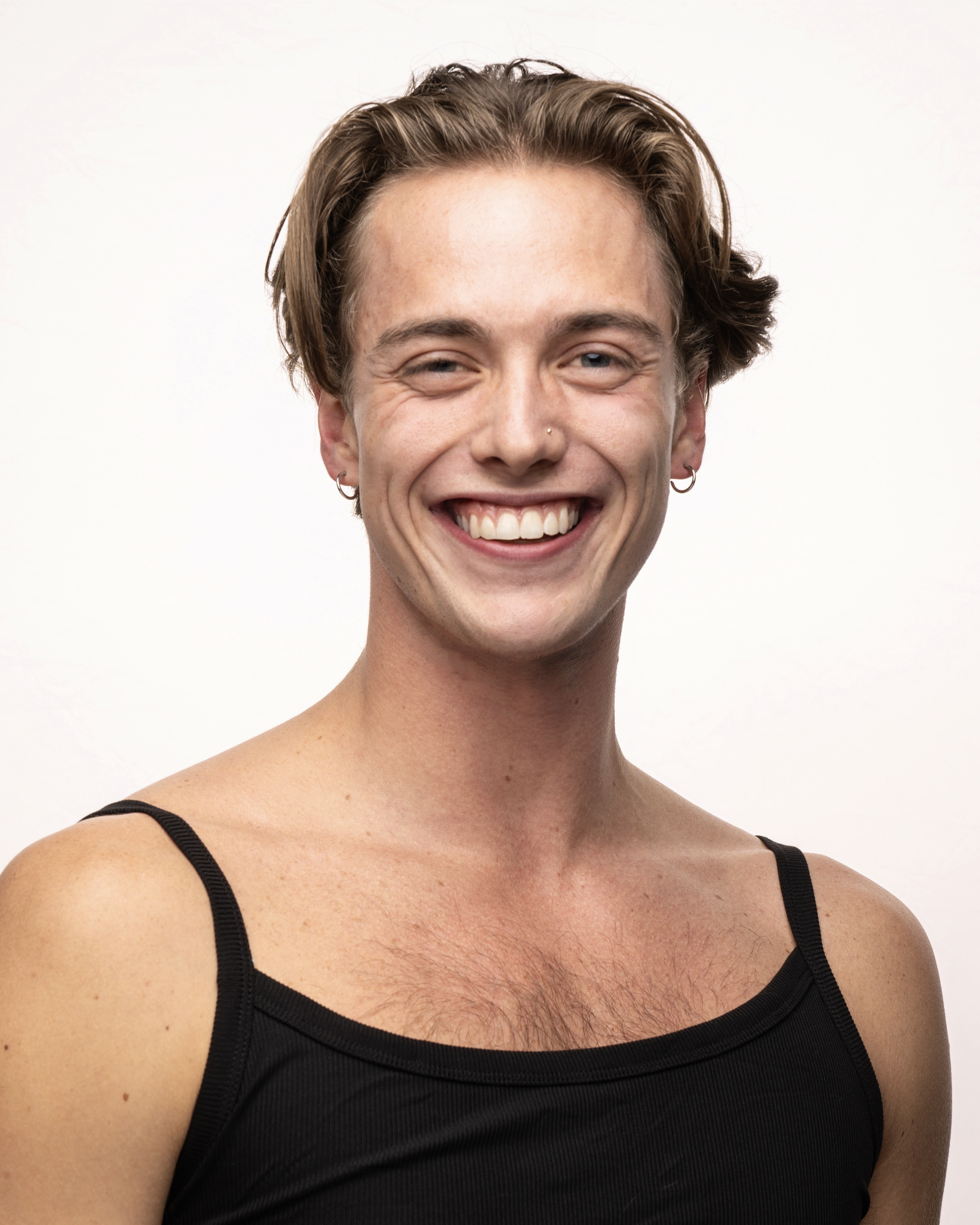 Headshot of Tyler - Male presenting dancer, 6’2 with brown hair and blue eyes